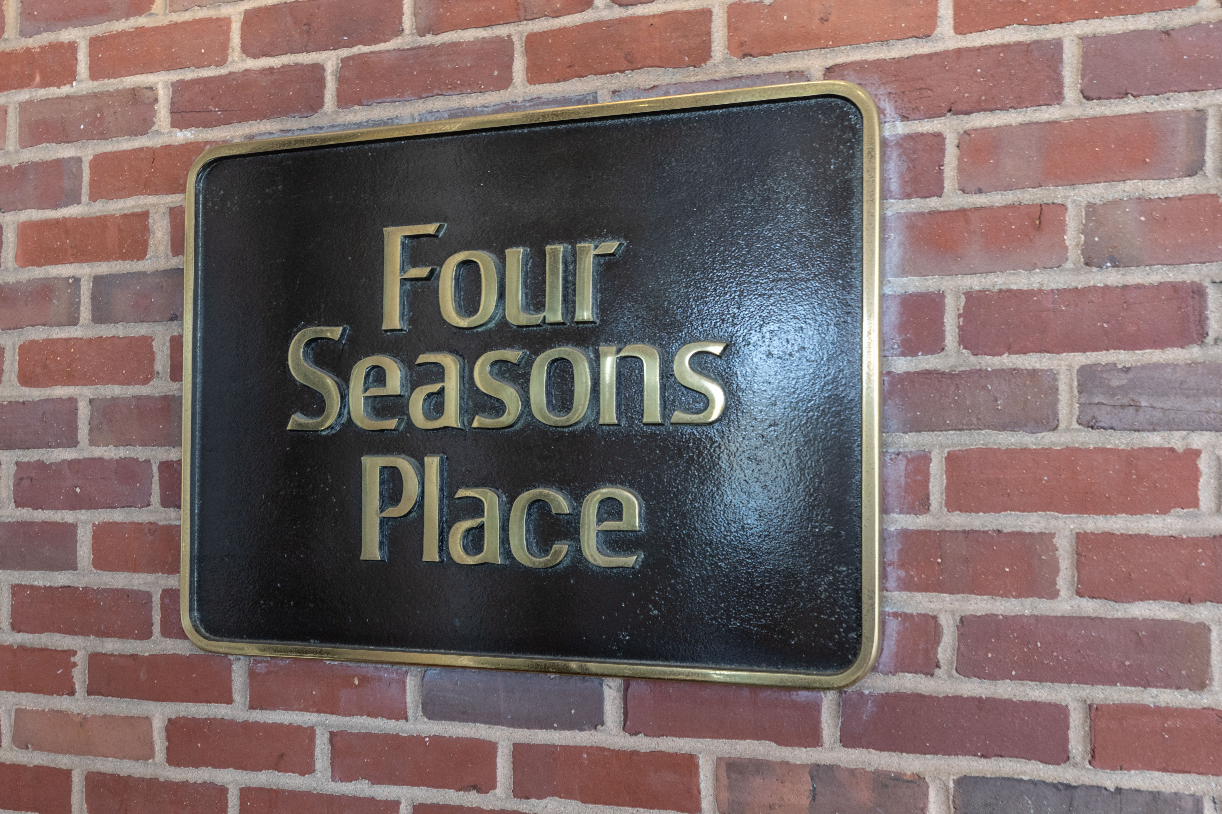 Four Seasons place brass plaque
