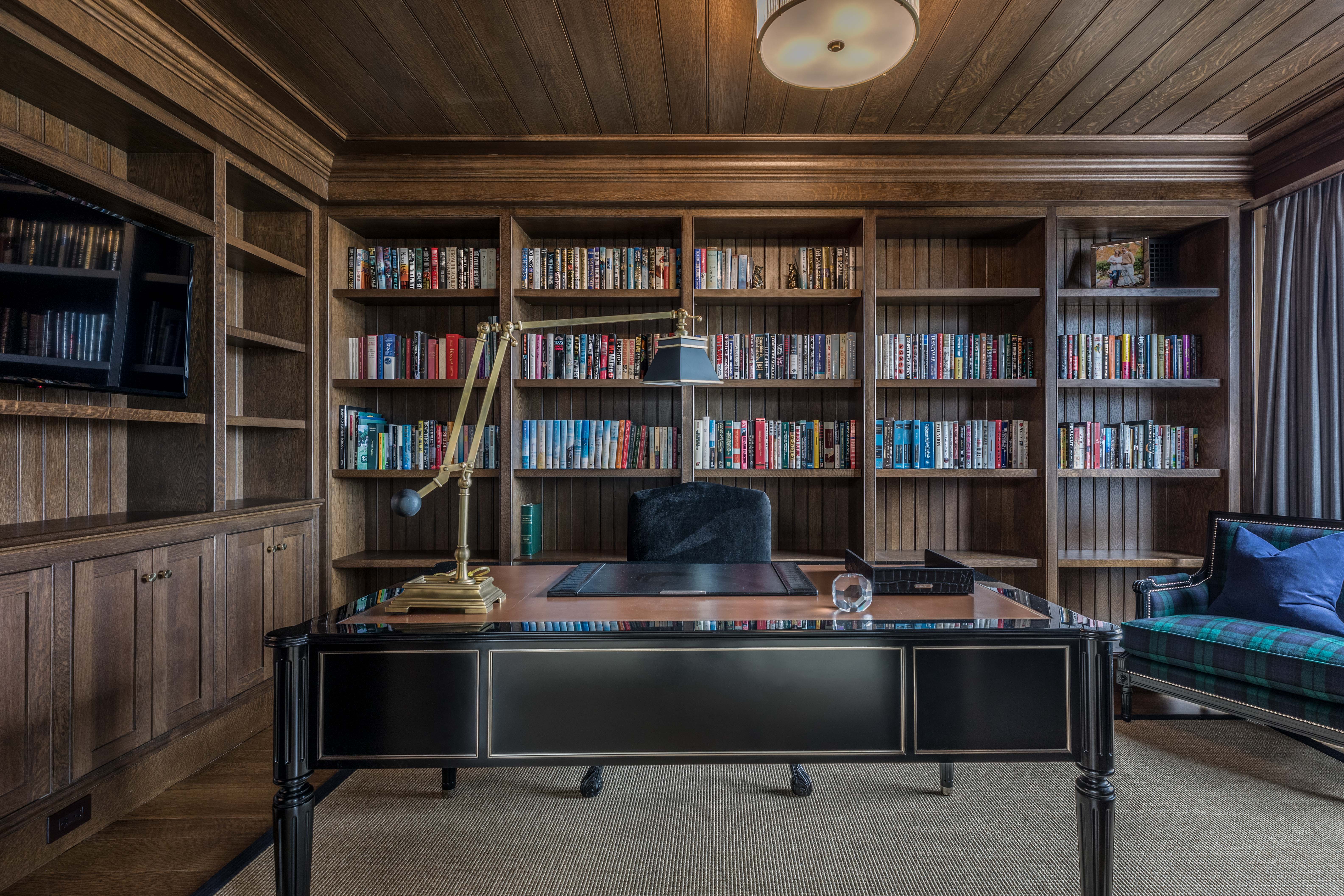 Wood-paneled library with custom built-ins